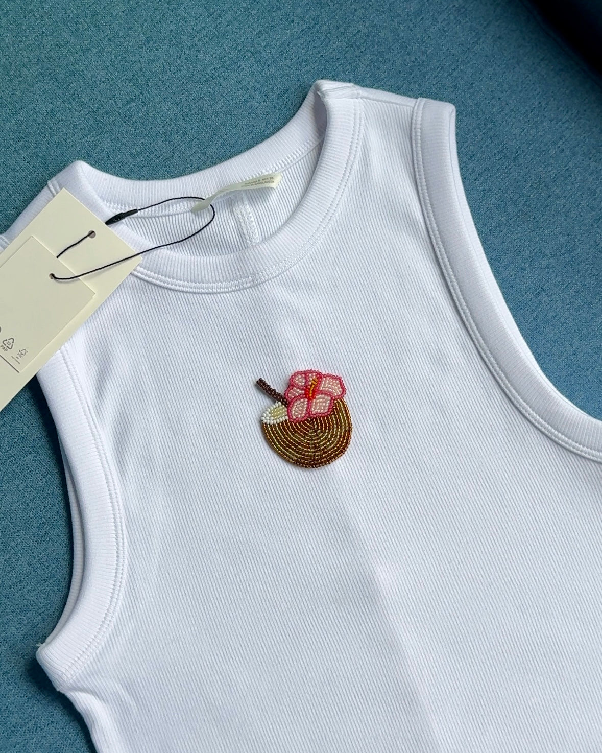 Original white ribbed tank with pink and brown beaded motif
