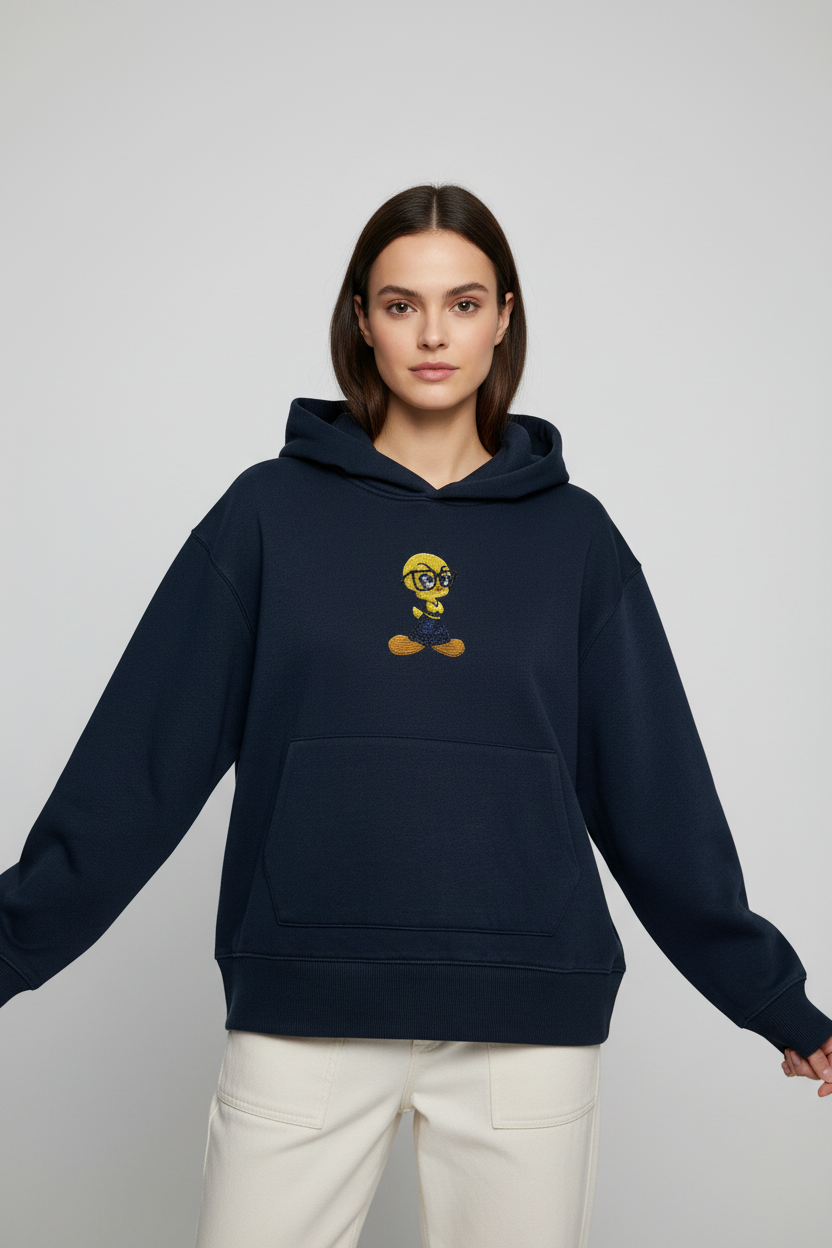 Front-facing model wearing navy hoodie with centered beaded bird motif