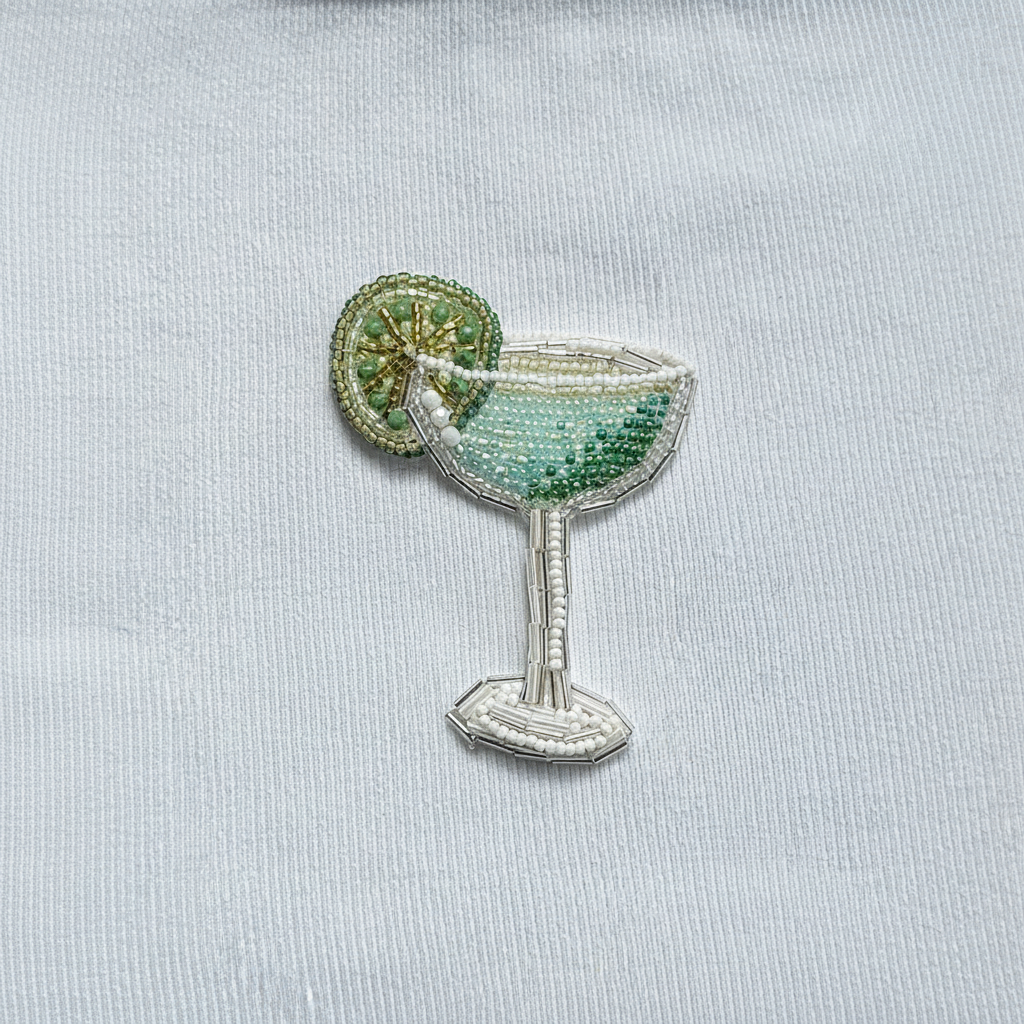 Green cocktail beadwork on white ribbed cotton top fabric